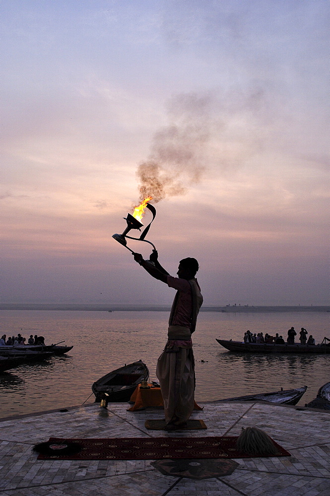 Sunrise ritual at the River Ganges, Varanasi (Benares), Uttar Pradesh, India, Asia