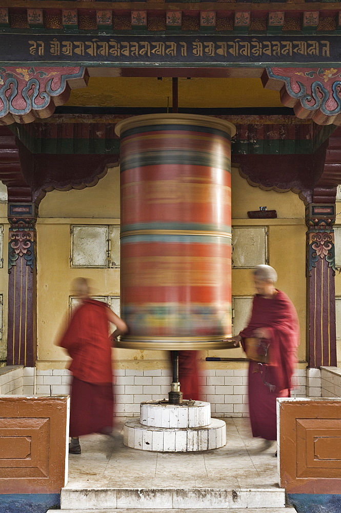 Buddhists turning prayer wheel, McLeod Ganj, Dharamsala, Himachal Pradesh state, India, Asia