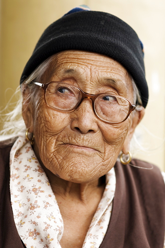 Portrait of a Tibetan woman, McLeod Ganj, Dharamsala, Himachal Pradesh state, India, Asia