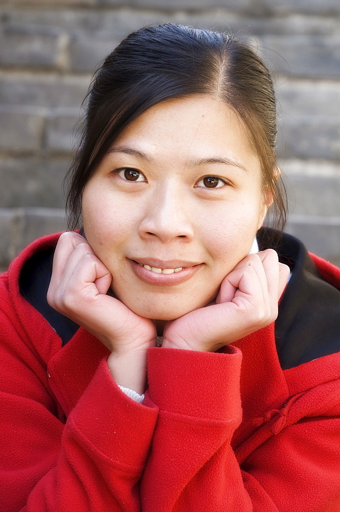 Portrait of a young Chinese woman at the Great Wall, Badaling, China, Asia