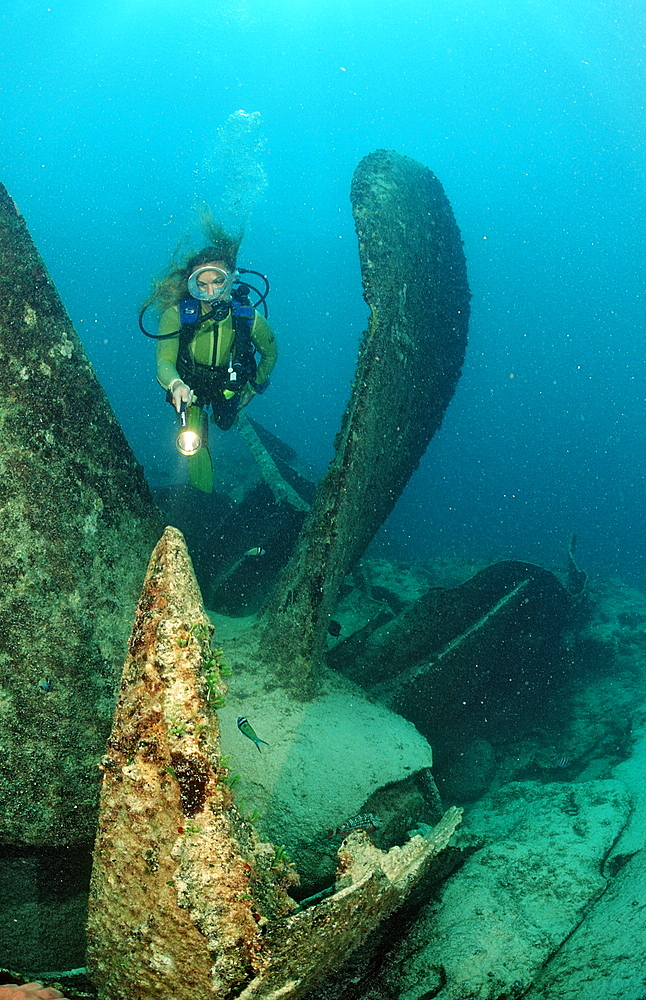 Scuba diver in and propeller of ship wreck Astron, Punta Cana, Dominican Republic, Caribbean, Central America