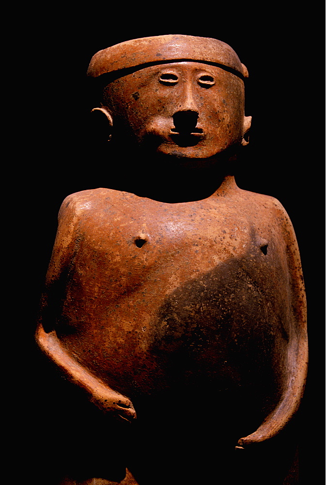 Capuli Culture a ceramic 'Coquero' funerary figure chewing coca, from the collection of the Banco Central de Ecuador, Quito, Ecuador