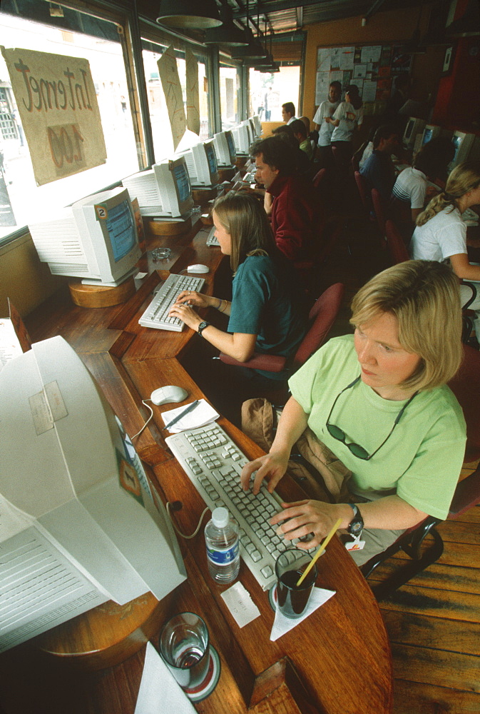 Students and travelers in the Papayanet Cyber Cafe on Avenida Juan Leon Mera in the New Town area of the city, Quito, Ecuador