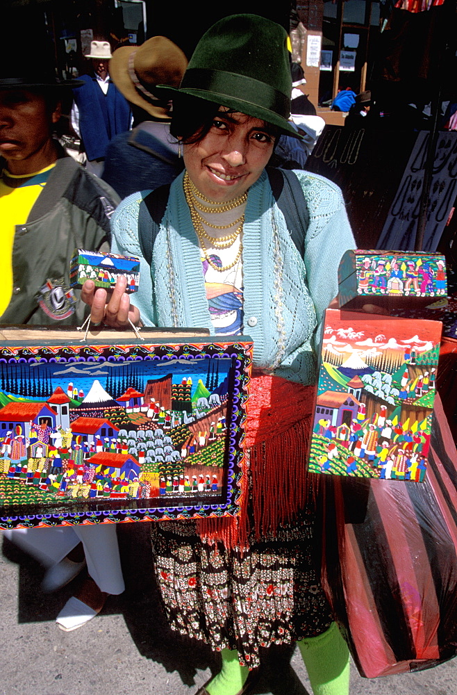 Otavalo, north of Quito is one of Latin Am's most famous markets for textiles, crafts and produce paintings of village scenes & life, Quito, Ecuador