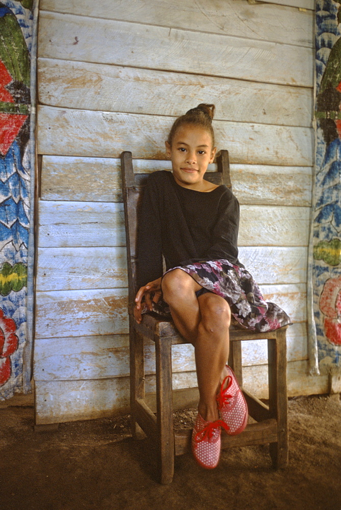 Portrait of a young girl in her home in the town of Barigua near Baracoa in eastern Cuba, Cuba