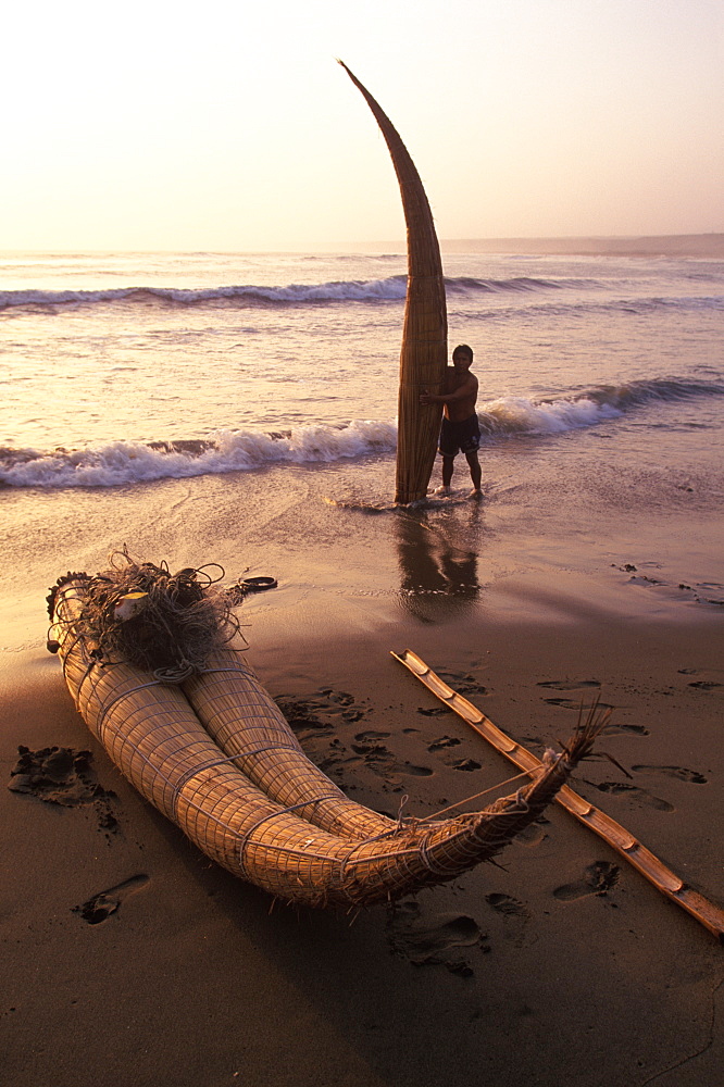 Caballitos de totora', small fishing boats woven of totora reeds in a style unchanged since pre-Inca times at Huanchaco beach, Trujillo, North Coast, Peru