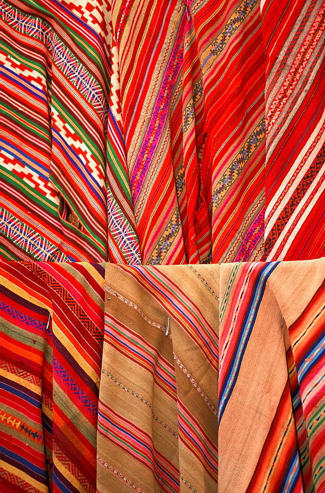 Pisac village in Sacred Valley of the Incas near Cuzco and famous for one of the world's most colorful markets traditional textiles, Highlands, Peru