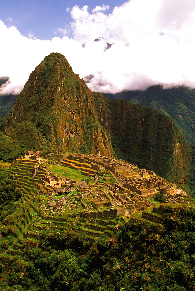 Machu Picchu view of the ancient city with Huayna Picchu Peak above the Rio Urubamba in the Vilcabamba Mountains, Highlands, Peru