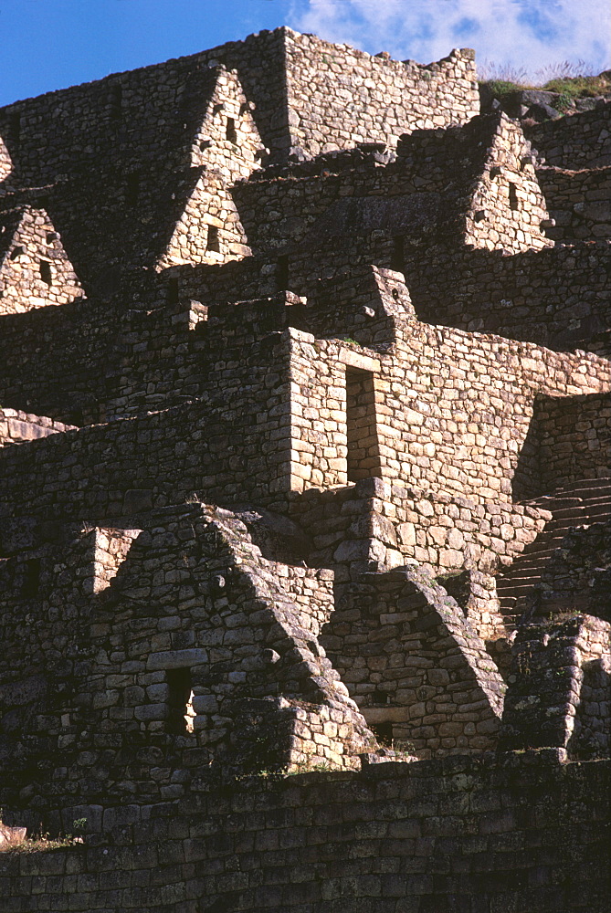 Machu Picchu roof lines, stone walls, windows and doorways of the Portal Group reveal Incan building features, Highlands, Peru