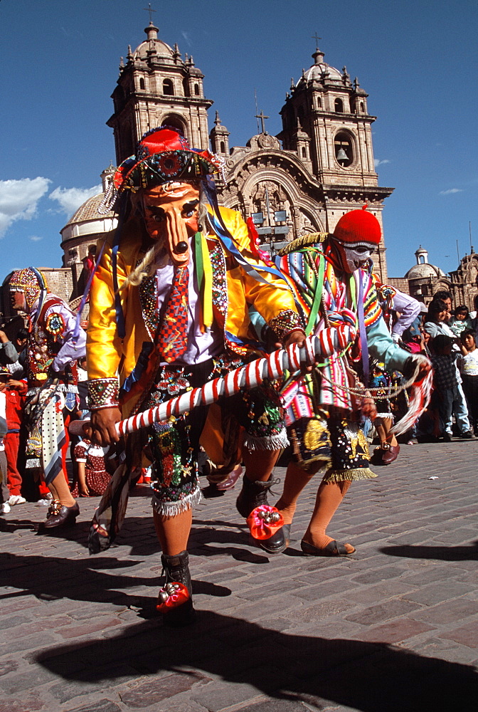 Corpus Christi is one of Peru's most famous festivals, costumed dancers perform the colonial mestizo Cholo in Plaza de Armas, Cuzco, Peru