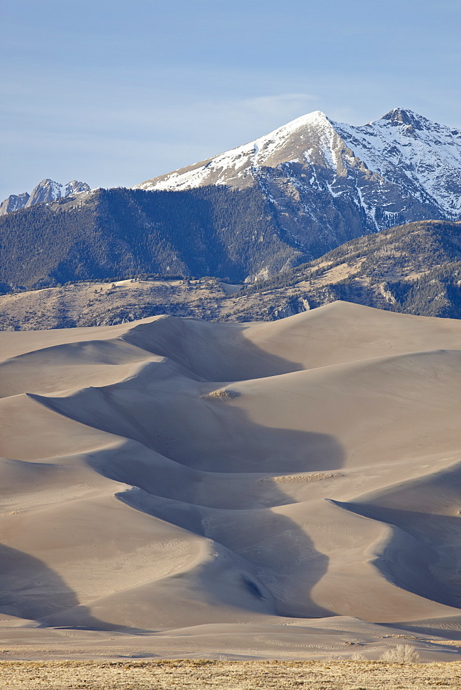 Great Sand Dunes and mountains with snow, Great Sand Dunes National Park and Preserve, Colorado, United States of America, North America