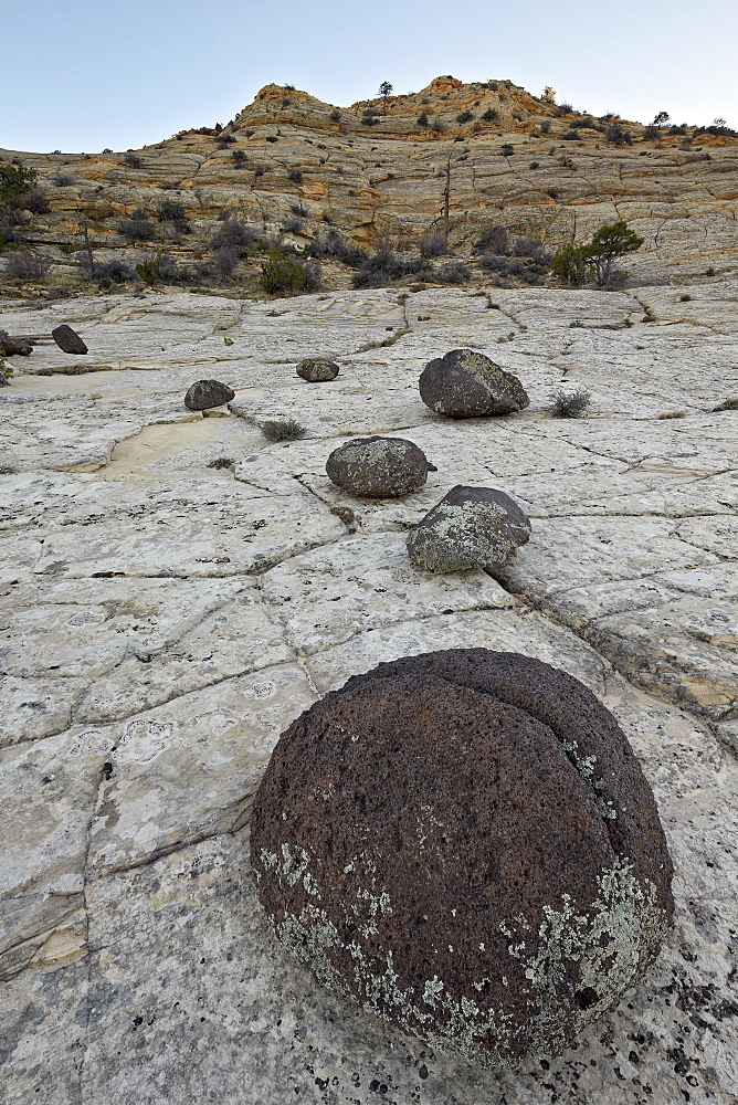 Volcanic boulders on Navajo sandstone, Grand Staircase-Escalante National Monument, Utah, United States of America, North America 