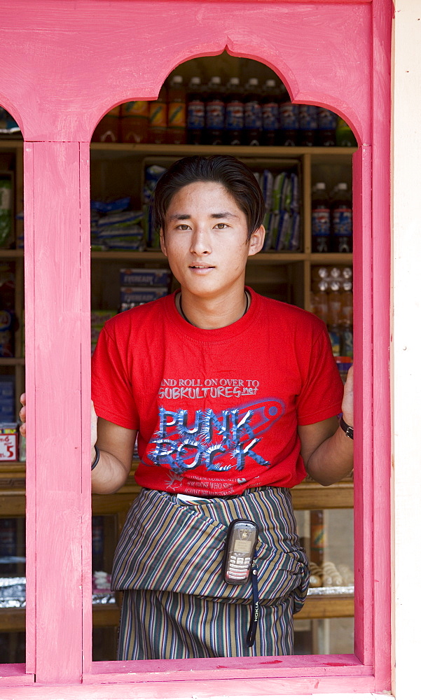 Young shop owner, village of Wangdue Phodrang, Bhutan, Asia