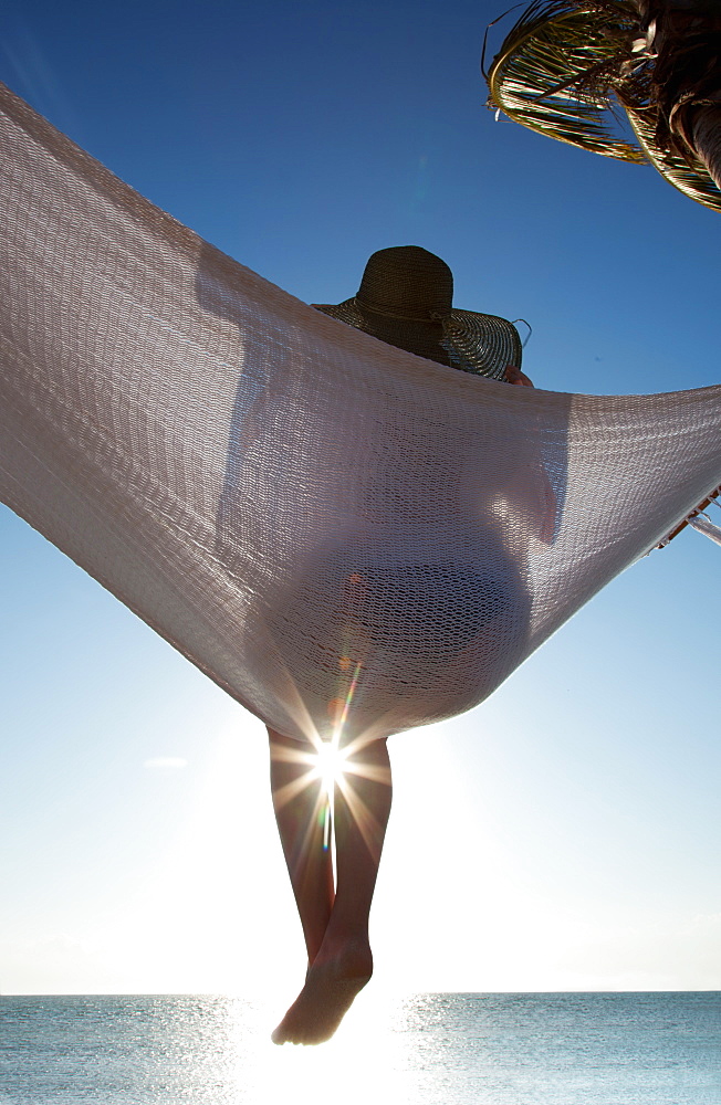 Woman in a hammock on the beach, Florida, United States of America, North America