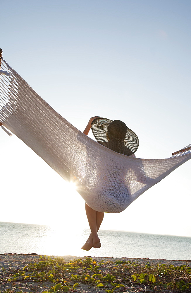 Woman on a hammock on the beach, Florida, United States of America, North America