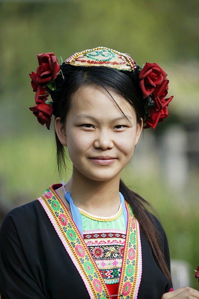 Young woman of Yao Minority mountain tribe in traditional costume, Li River, Yangshuo, Guangxi Province, China, Asia