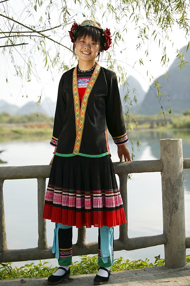 Young woman of Yao Minority mountain tribe, with traditional costume, Li River, Yangshuo, Guangxi Province, China, Asia