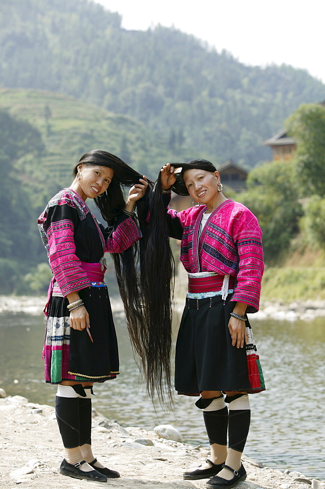 Young women of Yao Minority (Long hair) tribe, Huanglo Yao village, Longsheng terraced ricefields, Guangxi Province, Guilin, China, Asia