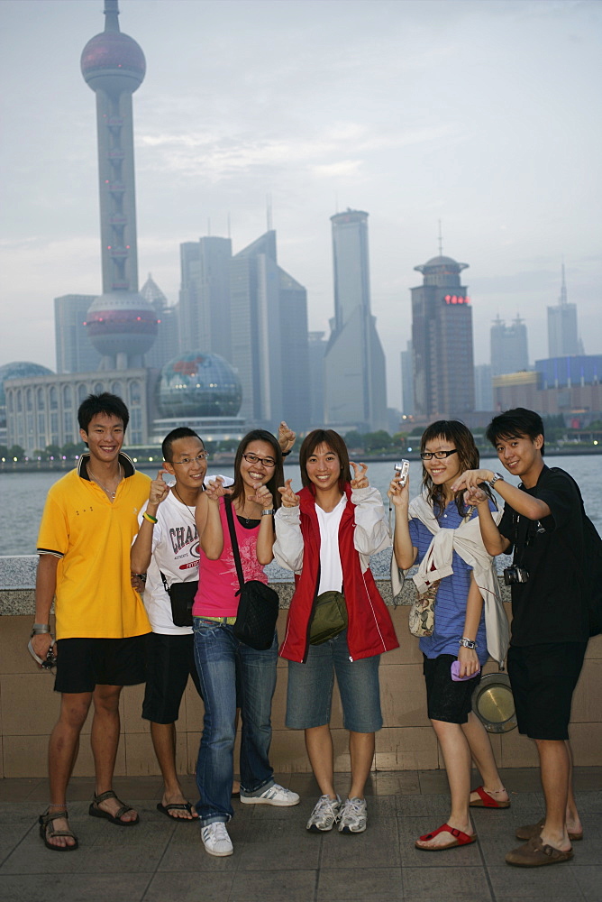 Young Chinese people on the Bund, Shanghai, China, Asia