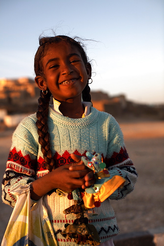 A local girl selling souvenirs on Luxor's West Bank, Egypt, North Africa, Africa