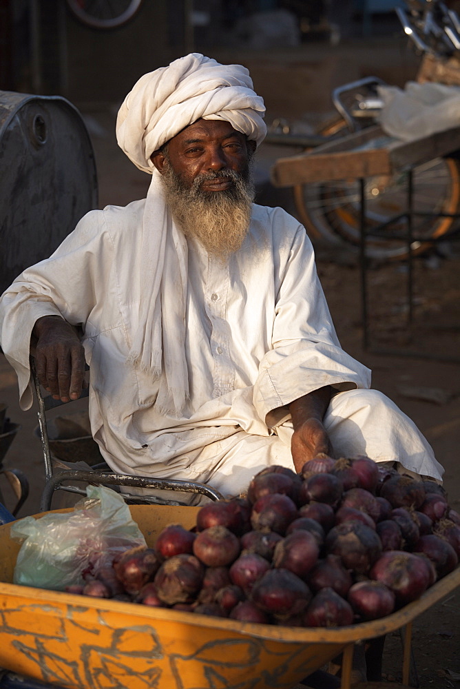 A local trader selling onions at Atbara Souq, Sudan, Africa