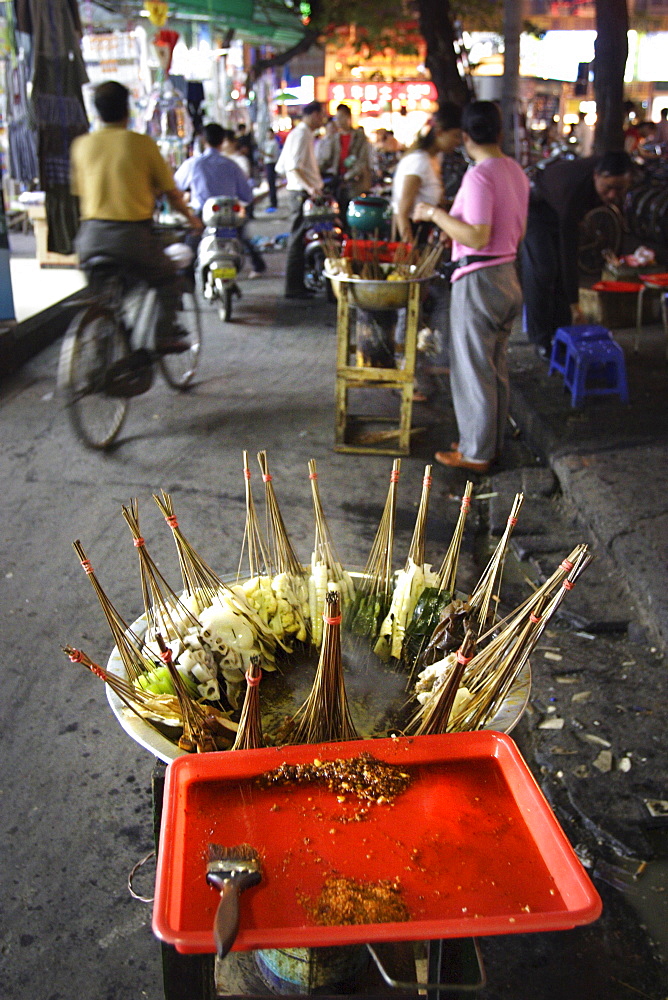 Skewers cook in a Sichuanese hotpot, Chengdu, China, Asia