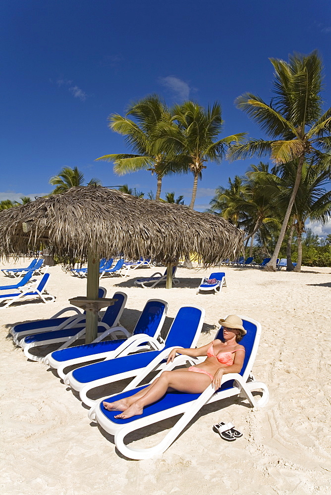 Woman on a lounger, Princess Cays, Eleuthera Island, Bahamas, Greater Antilles, West Indies, Caribbean, Central America