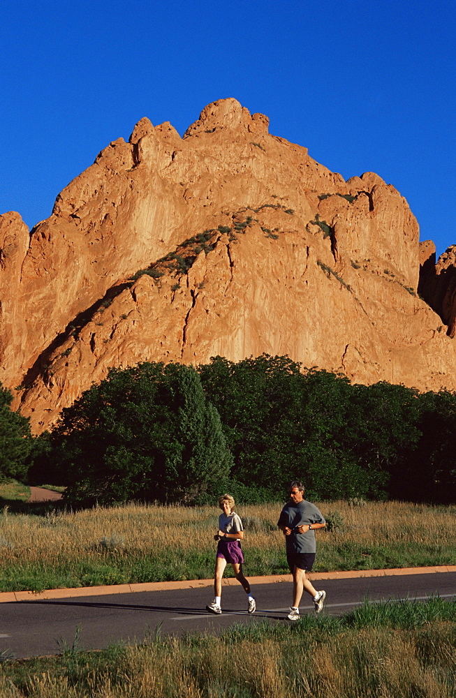 Couple jogging, Garden of the Gods Park, Colorado Springs, Colorado, United States of America, North America