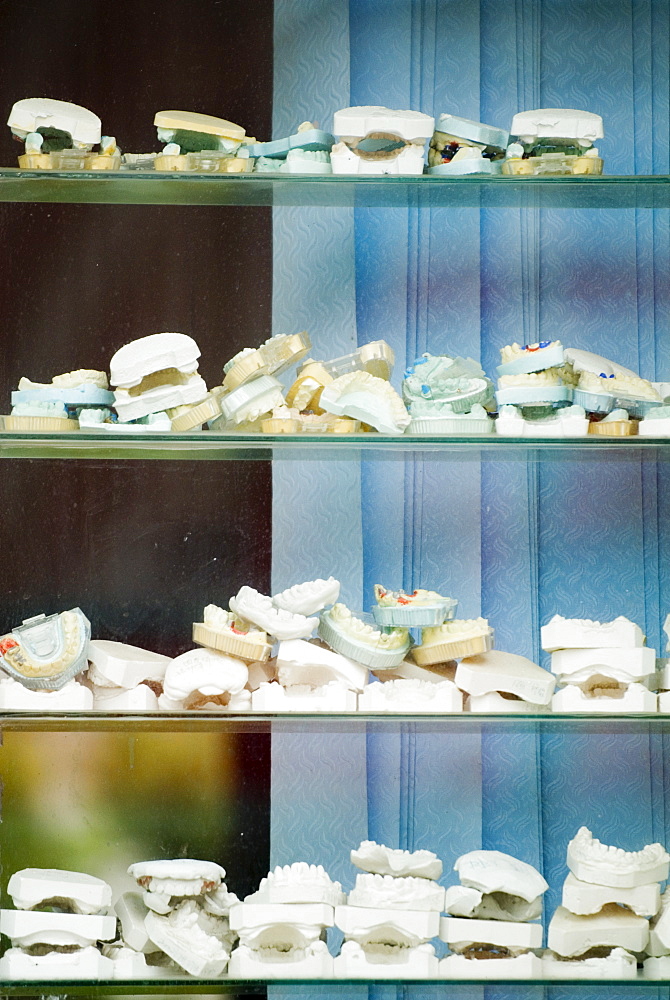 Dentist's window and collection of teeth moulds, Zhongdian, Shangri-La County, Yunnan Province, China, Asia