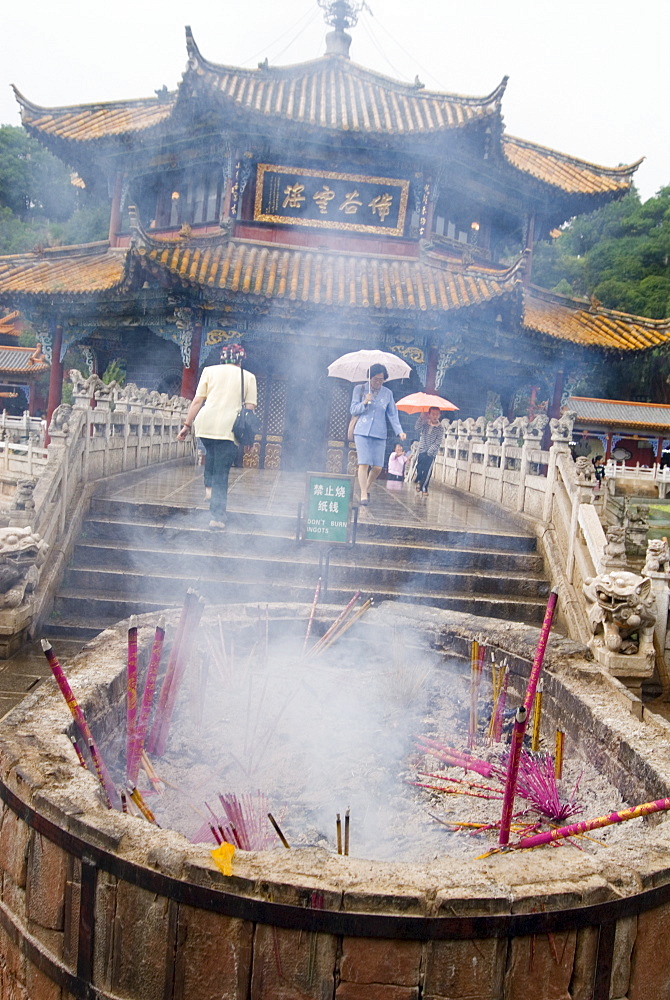 Incense sticks burning in front of Yuantong Temple, Kunming, Yunnan, China, Asia