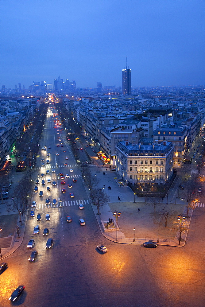 Avenue de la Grande Armee at night with La Defense in the distance from the Arc de Triomphe, Paris, France, Europe