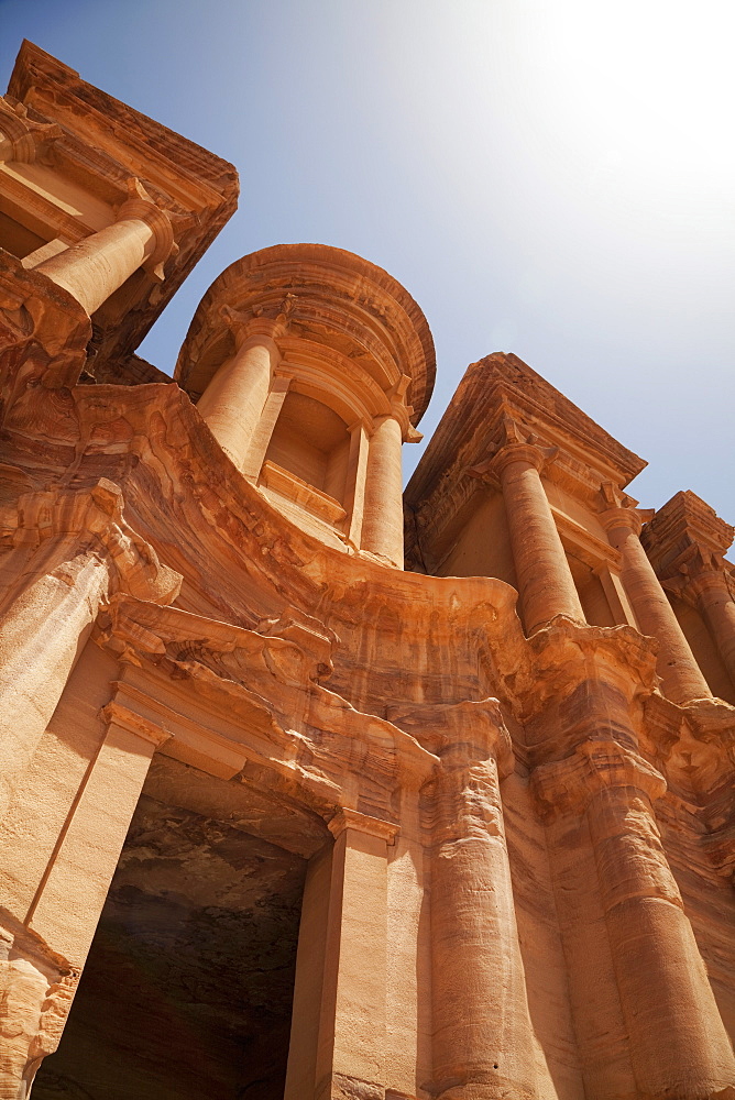 The facade of the Monastery carved into the red rock at Petra, UNESCO World Heritage Site, Jordan, Middle East