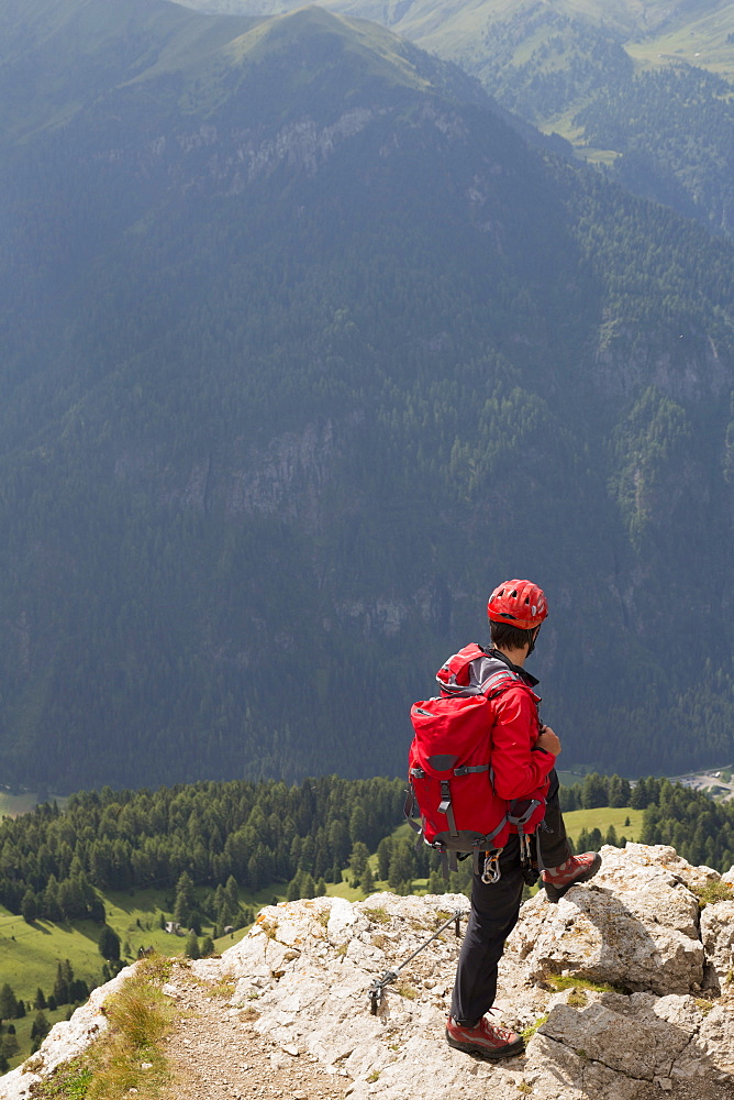 Climbers on the Sassolungo mountains in the Dolomites near Canazei, Italy, Europe