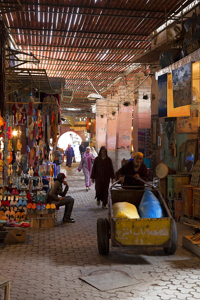 People in traditional dress walking through the souks, Marrakech, Morocco, North Africa, Africa