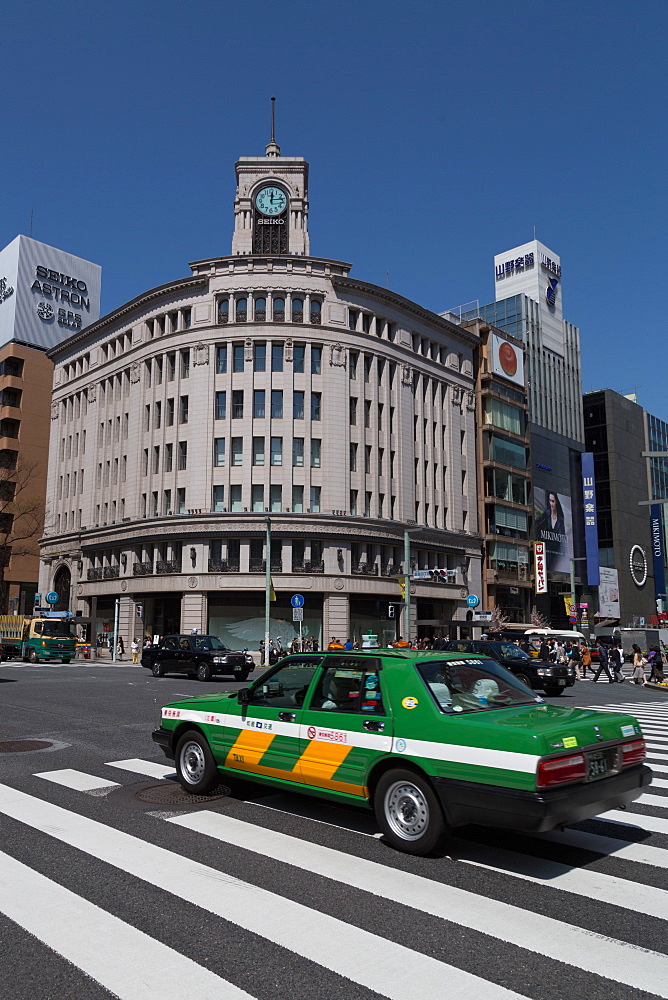 Taxi passing Wako department store in the Ginza district of Tokyo, Japan, Asia