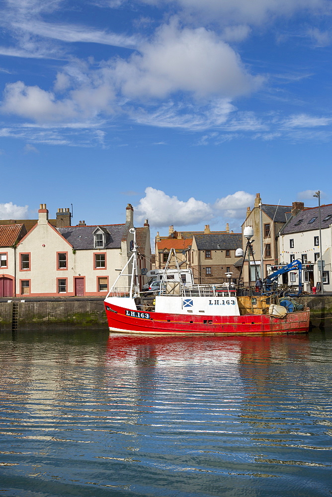 Traditional fishing boat in the sheltered harbour at Eyemouth, Berwickshire, Scottish Borders, Scotland, United Kingdom, Europe