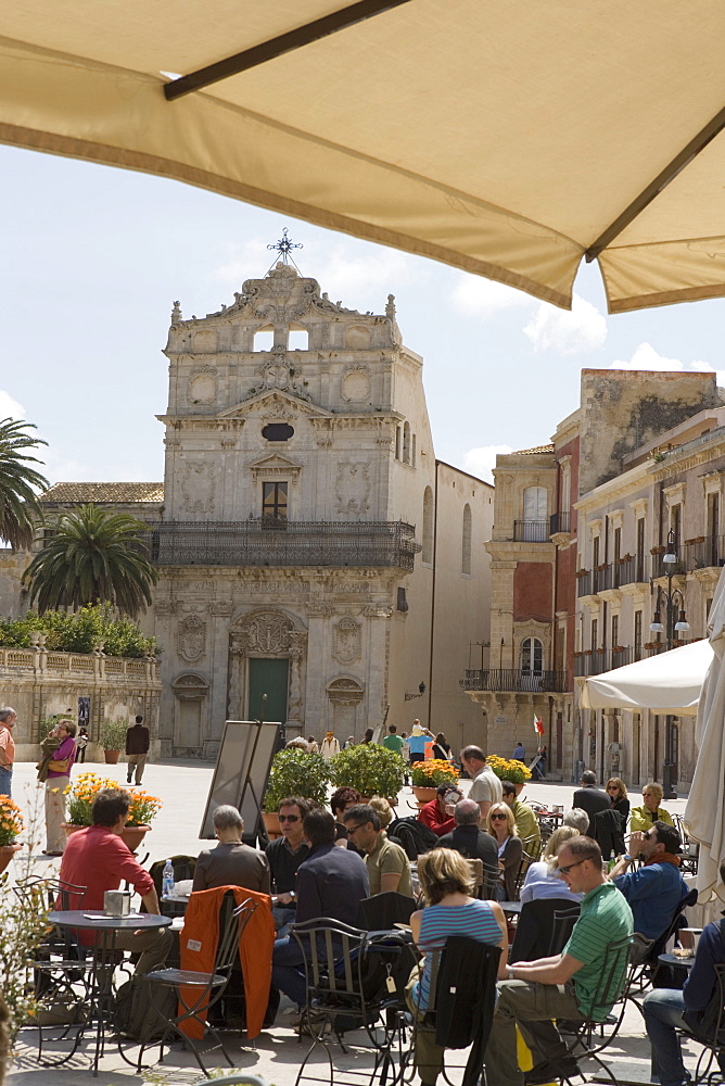 Facade of Santa Lucia alla Badia and cafe in the Piazza Duomo, Ortygia, Syracuse, Sicily, Italy, Europe