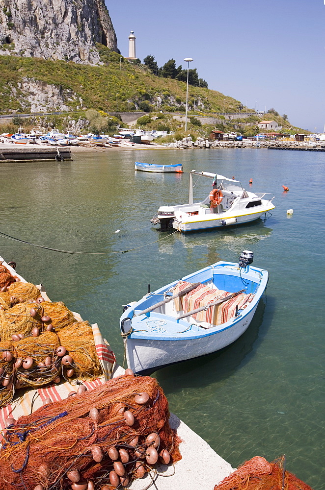 Fishing nets and traditional fishing boats, lighthouse, harbour, Cefalu, Sicily, Italy, Europe