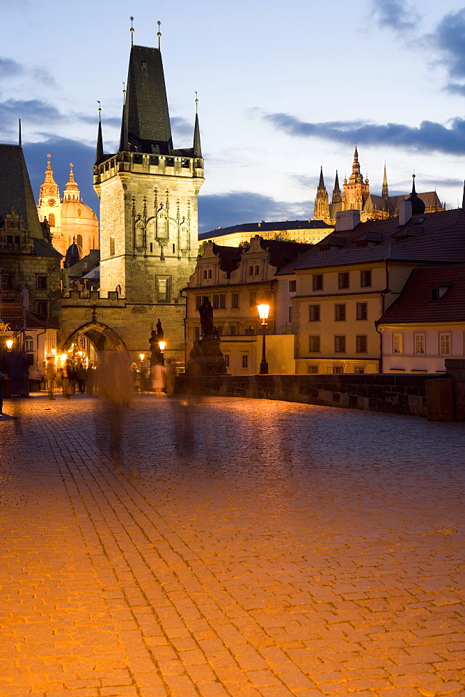 Little Quarter Bridge Tower, with St. Vitus's Cathedral, in the distance, taken from Charles Bridge, Little Quarter, in the evening, Prague, Czech Republic, Europe