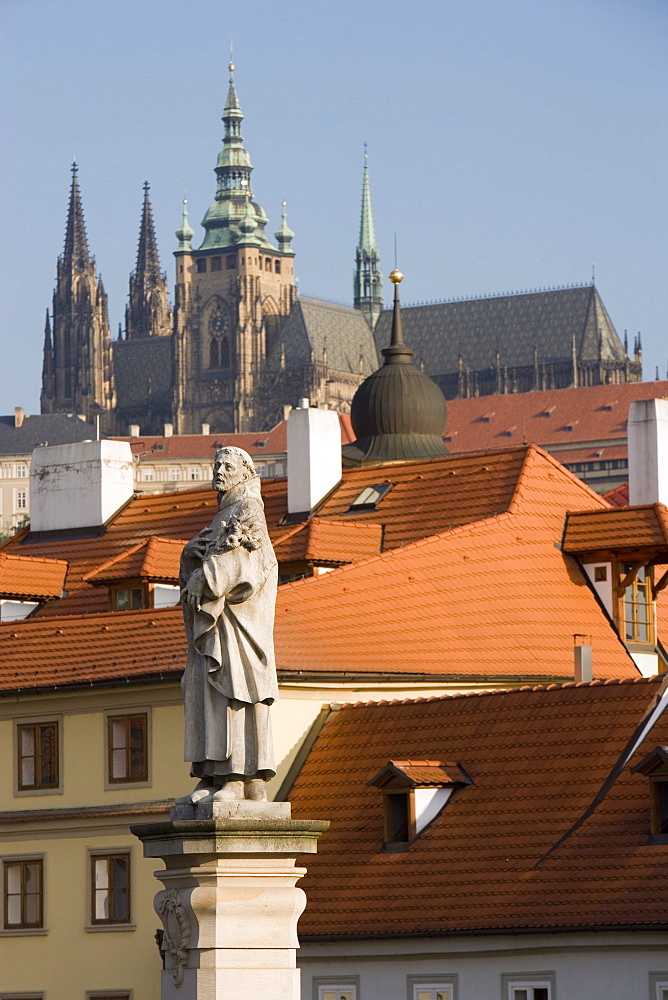 Statue of St. Philip Benizi, St. Vitus's Cathedral, Royal Palace and Castle from Charles Bridge, UNESCO World Heritage Site, Prague, Czech Republic, Europe