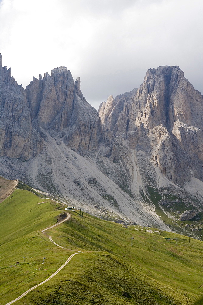 Footpath on ridge near Gruppo dei Sassolungo mountains, Dolomites, Italy, Europe