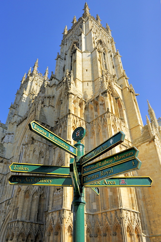 Tourist information signpost with York Minster in the background, Duncombe Place, York, Yorkshire, England, United Kingdom, Europe