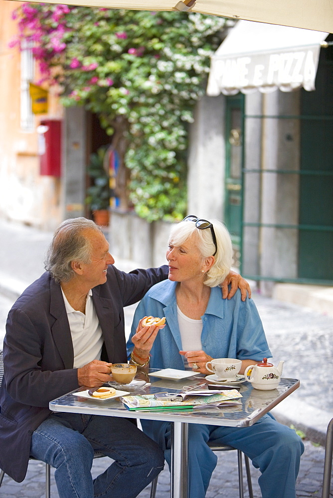 Senior tourists having breakfast in a local cafe, Rome, Lazio, Italy, Europe