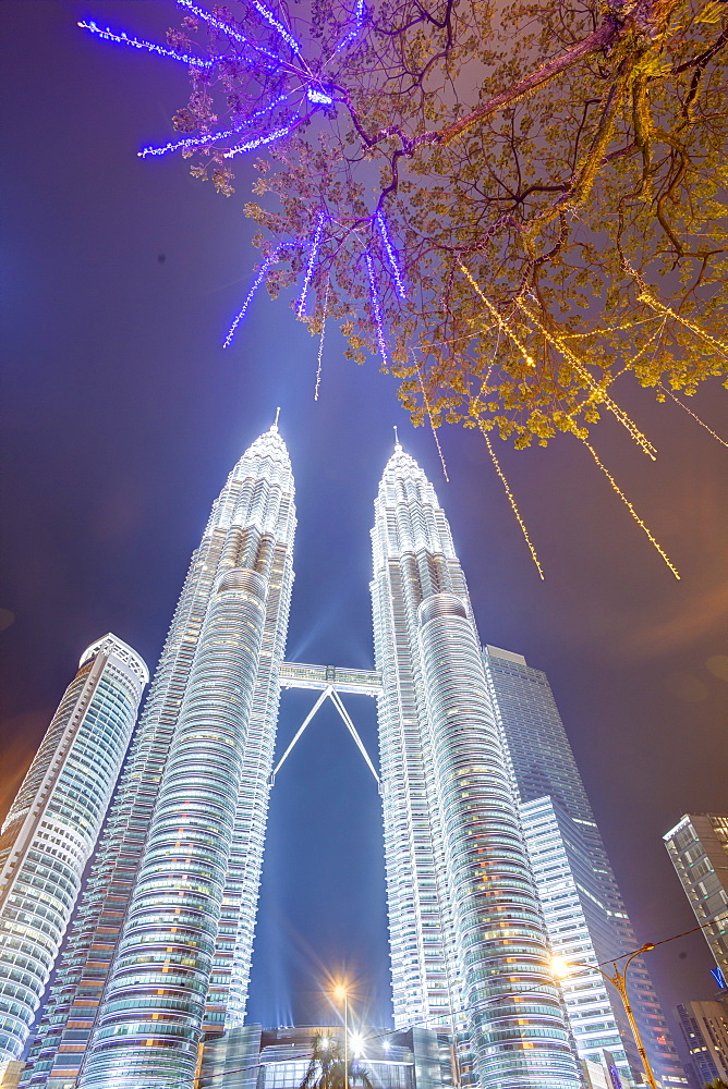 Low angle view of the Petronas Twin Towers, Kuala Lumpur, Malaysia, Southeast Asia, Asia