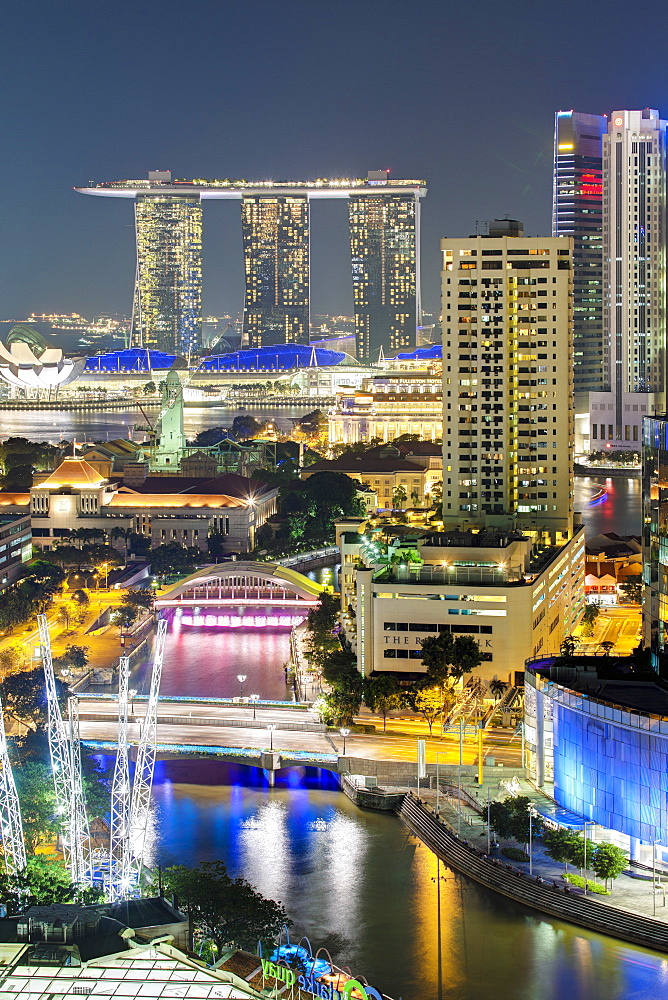 Elevated view over the Entertainment district of Clarke Quay, the Singapore River and city skyline at night, Singapore, Southeast Asia, Asia