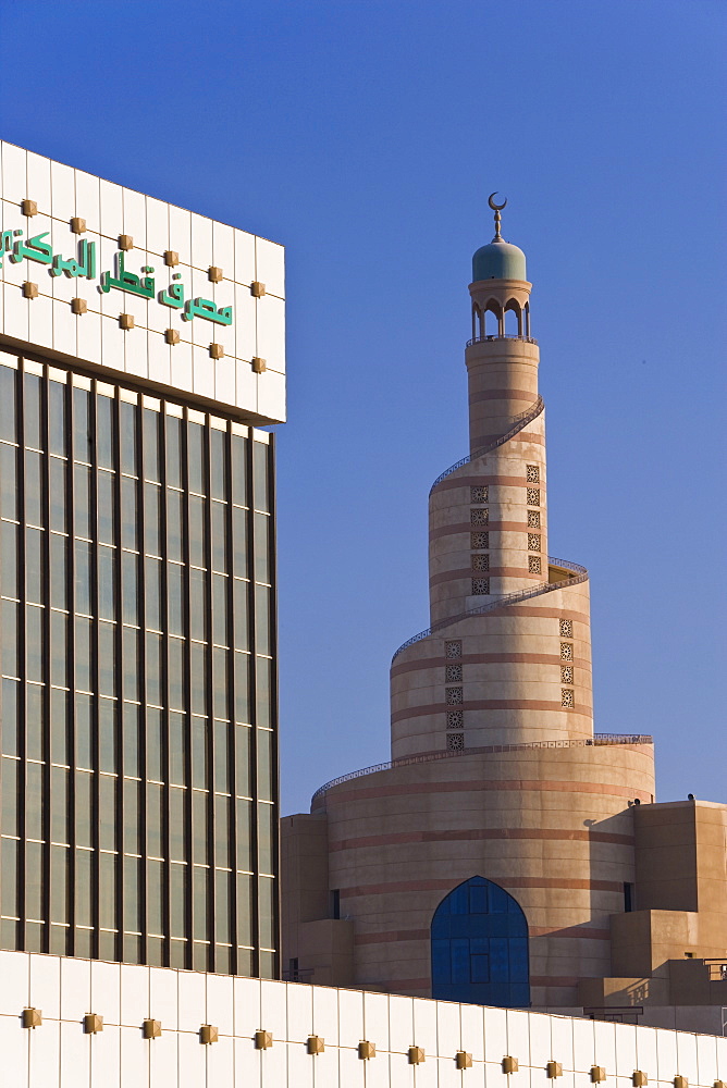 Qatar Central Bank and the spiral mosque of the Kassem Darwish Fakhroo Islamic Centre in Doha based on the Great Mosque in Samarra in Iraq, Doha, Qatar, Middle East