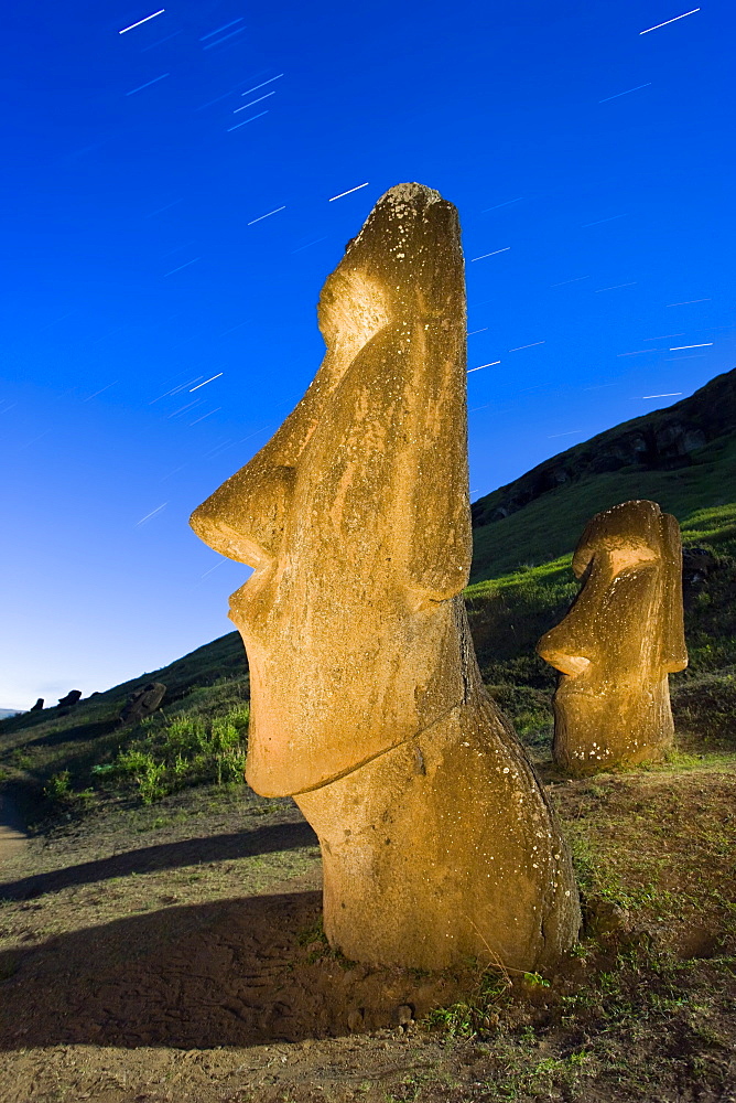 Maoi statues at Rano Raraku, illuminated at dusk, Easter Island (Rapa Nui), UNESCO World Heritage Site, Chile, South America