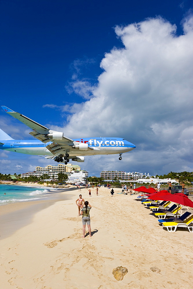 Beach at Maho Bay and low flying aircraft approaching the runway of Princess Juliana International airport, St. Martin (St. Maarten), Leeward Islands, West Indies, Caribbean, Central America