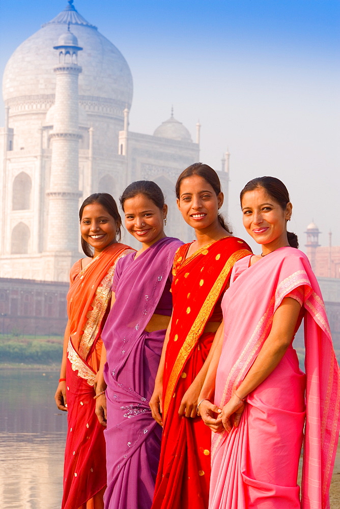 Women in bright saris at the Taj Mahal, UNESCO World Heritage Site, Agra, Uttar Pradesh, India, Asia 