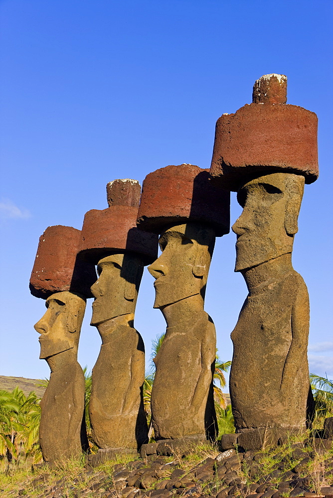 Anakena beach, monolithic giant stone Moai statues of Ahu Nau Nau, four of which have topknots, Rapa Nui (Easter Island), UNESCO World Heritage Site, Chile, South America